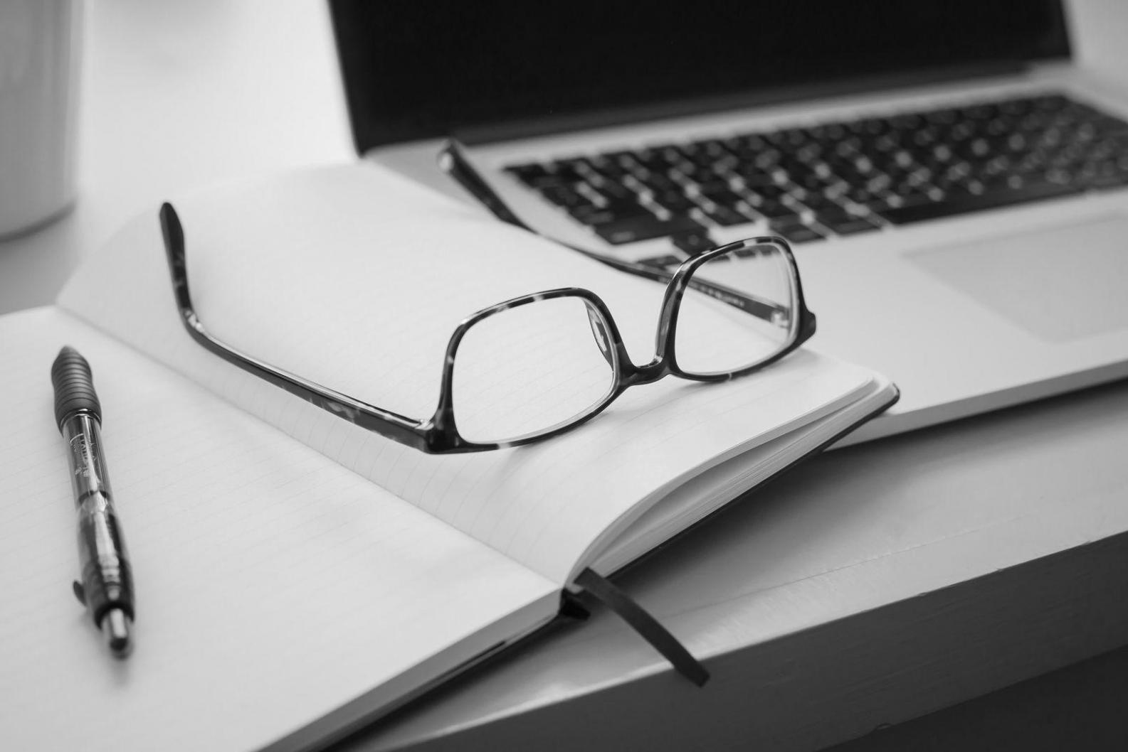 Creative workspace with writing materials and strategy notes